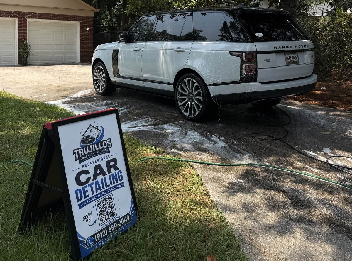 Freshly detailed white Range Rover after Trujillo's car detailing service