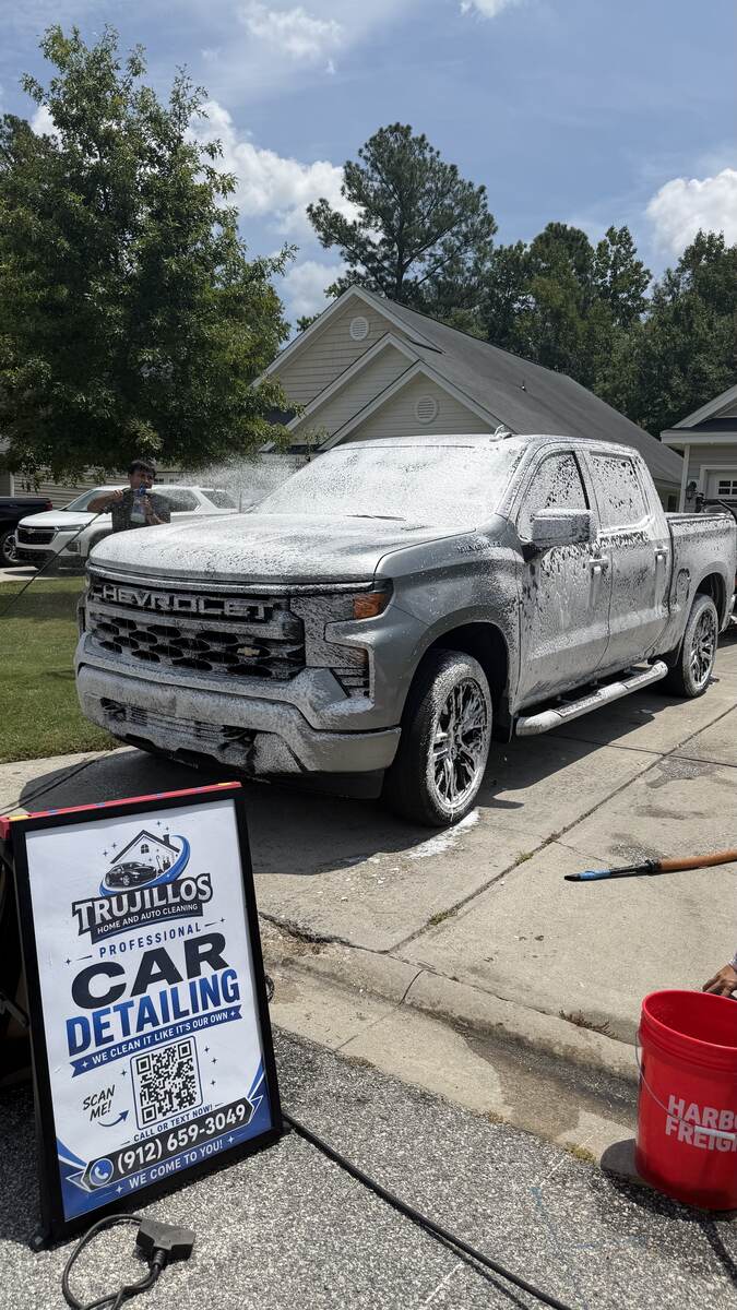 Foam-washed Chevrolet Silverado parked on a residential street